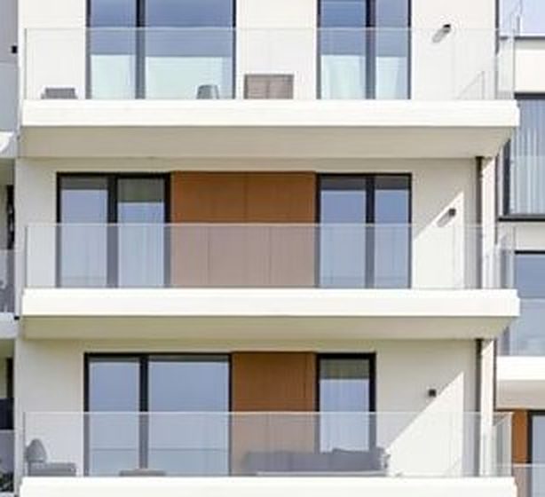 White facade with wood-look cladding panels
