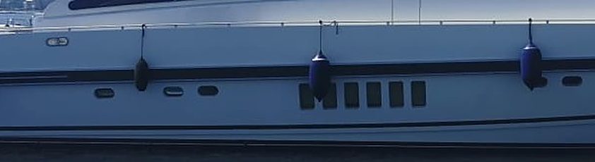 Yacht hull with fenders and vents