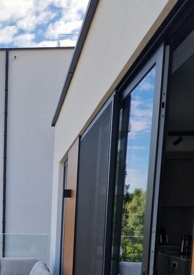 Black window frame on a white facade