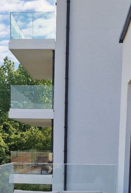 Stacked balconies with glass balustrades